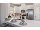 Modern kitchen with white cabinetry and stainless steel appliances at 5340 Spoonflower Ct, St Cloud, FL 34771