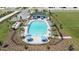 Community pool with lounge chairs and umbrellas at 2006 Babbling Brook Blvd, Auburndale, FL 33823