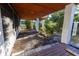 Partially landscaped backyard with covered patio at 3203 S Polk Ave, Lakeland, FL 33803
