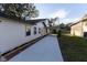 House exterior with side driveway and landscaping at 3203 E Polk Ave, Lakeland, FL 33803