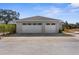 Two-car garage with double doors and large driveway at 8631 Sw 70Th Ter, Bushnell, FL 33513