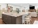 Stunning kitchen island with a large marble countertop and seating for three at 8631 Sw 70Th Ter, Bushnell, FL 33513