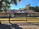 Community building with large windows and inviting exterior at 25232 Ne 142Nd St, Fort Mc Coy, FL 32134