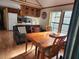 Kitchen and dining area with table and chairs at 25232 Ne 142Nd St, Fort Mc Coy, FL 32134