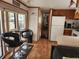 Kitchen with wood cabinets, appliances, and breakfast bar at 25232 Ne 142Nd St, Fort Mc Coy, FL 32134