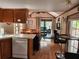 Kitchen with island, dining area, and view to living room at 25232 Ne 142Nd St, Fort Mc Coy, FL 32134