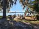 Wooden deck overlooking a peaceful lake at 25232 Ne 142Nd St, Fort Mc Coy, FL 32134