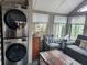 Stackable LG washer and dryer in sunroom at 25232 Ne 142Nd St, Fort Mc Coy, FL 32134