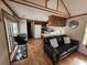 Open living room and kitchen with wood floors at 25232 Ne 142Nd St, Fort Mc Coy, FL 32134