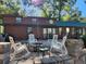 Relaxing patio with fire pit and rocking chairs at 25232 Ne 142Nd St, Fort Mc Coy, FL 32134