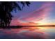 Stunning sunset over calm water, reflecting vibrant colors at 25232 Ne 142Nd St, Fort Mc Coy, FL 32134