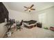 Spacious bedroom with desk and ceiling fan at 2807 Polson Dr, Kissimmee, FL 34758