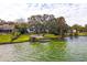Scenic aerial view showcasing the home's waterfront location and private dock at 1212 Lake Point Dr, Lakeland, FL 33813
