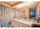 Bright bathroom with vanity, large mirror, and shower/tub combo at 1212 Lake Point Dr, Lakeland, FL 33813