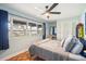 Tranquil bedroom with calming blue walls, and lake views from large window at 1212 Lake Point Dr, Lakeland, FL 33813