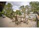 Spacious deck with wooden furniture, perfect for outdoor dining and relaxation at 1212 Lake Point Dr, Lakeland, FL 33813