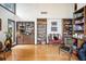 Home office with built-in shelves, a wet bar, and plenty of natural light at 1212 Lake Point Dr, Lakeland, FL 33813