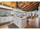 Spacious kitchen with white cabinetry, large island, and wood ceiling at 1212 Lake Point Dr, Lakeland, FL 33813