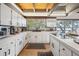 Bright white kitchen with ample counter space and views of the lake at 1212 Lake Point Dr, Lakeland, FL 33813