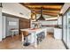 Modern kitchen featuring an island with bar seating and white cabinetry at 1212 Lake Point Dr, Lakeland, FL 33813