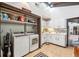 Laundry room with washer, dryer, storage, and folding counter space at 1212 Lake Point Dr, Lakeland, FL 33813