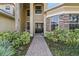 Front entry with a stone facade and walkway at 1872 Eloise Cove Dr, Winter Haven, FL 33884