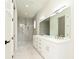 Spa-like bathroom with double vanity and large walk-in shower at 3225 Parkwood Ct, Kissimmee, FL 34744