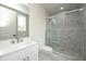 Clean bathroom with white vanity and a large walk-in shower at 3225 Parkwood Ct, Kissimmee, FL 34744
