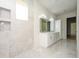 Modern bathroom with double vanity and mosaic tile accents at 3225 Parkwood Ct, Kissimmee, FL 34744