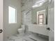 Modern bathroom with marble flooring and floating vanity at 3225 Parkwood Ct, Kissimmee, FL 34744