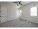 Spacious bedroom with gray carpet and large windows at 3225 Parkwood Ct, Kissimmee, FL 34744