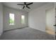 Spacious bedroom with grey carpet and large windows at 3225 Parkwood Ct, Kissimmee, FL 34744