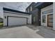 Modern home with attached two-car garage and stone facade at 3225 Parkwood Ct, Kissimmee, FL 34744
