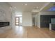 Light filled living room with hardwood floors and marble fireplace at 3225 Parkwood Ct, Kissimmee, FL 34744