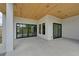 Modern covered patio with sleek sliding glass doors at 3225 Parkwood Ct, Kissimmee, FL 34744
