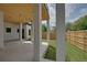 Covered patio with wood ceiling and access to backyard at 3225 Parkwood Ct, Kissimmee, FL 34744