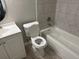 Clean bathroom with a tub, toilet and vanity at 619 N Delmonte Ct, Kissimmee, FL 34758