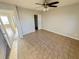 Bedroom with ceiling fan and tiled floors at 619 N Delmonte Ct, Kissimmee, FL 34758