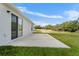 Spacious backyard patio with sliding glass doors and grassy area at 2162 Hadley Rd, Bartow, FL 33830