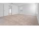 Bright and airy bedroom with neutral carpeting and access to a bathroom at 2162 Hadley Rd, Bartow, FL 33830