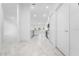 Bright hallway with marble-look tile flooring at 2162 Hadley Rd, Bartow, FL 33830