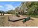 Community playground with play equipment and bench at 2162 Hadley Rd, Bartow, FL 33830
