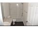 Bathroom with a tub shower combo and granite countertop at 1051 Woodlark Dr, Haines City, FL 33844