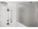 Modern bathroom with white wave tile and glass shower door at 1051 Woodlark Dr, Haines City, FL 33844