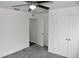 Spacious bedroom with grey carpet and double door closet at 1051 Woodlark Dr, Haines City, FL 33844