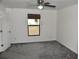 Spacious bedroom with grey carpet and ceiling fan at 1051 Woodlark Dr, Haines City, FL 33844