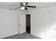 Bedroom with grey carpet and a door to the hallway at 1051 Woodlark Dr, Haines City, FL 33844