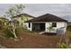 Back of house showing screened porch and yard at 1051 Woodlark Dr, Haines City, FL 33844