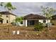 View of house back, showing yard and screened porch at 1051 Woodlark Dr, Haines City, FL 33844