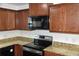 Kitchen with granite countertops and stainless steel appliances at 1051 Woodlark Dr, Haines City, FL 33844